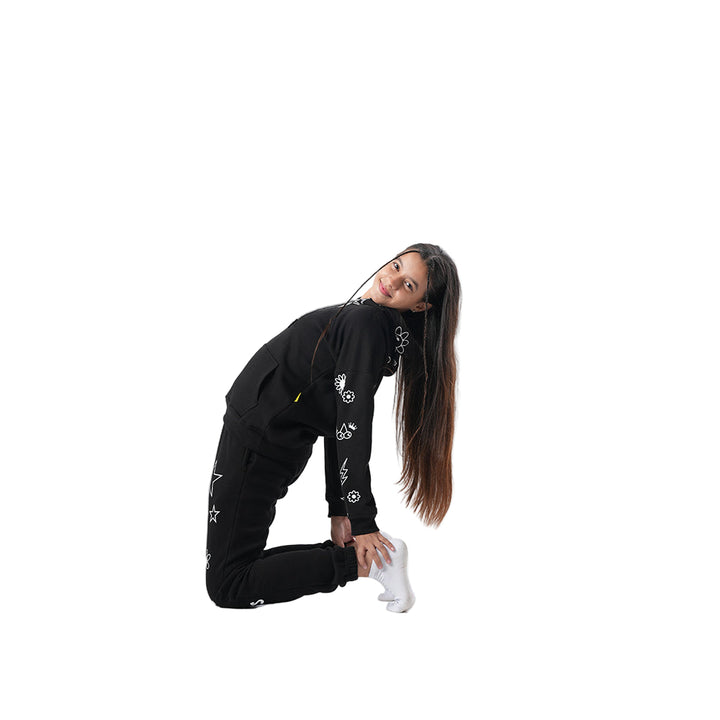 Person wearing a black outfit with white patterns on a white background