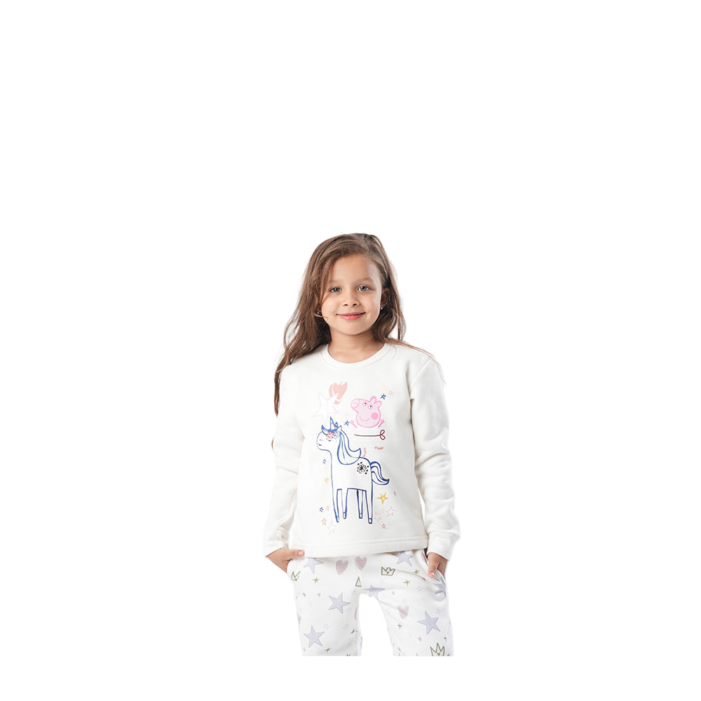 Young girl wearing a white sweatshirt with a colorful design on a white background