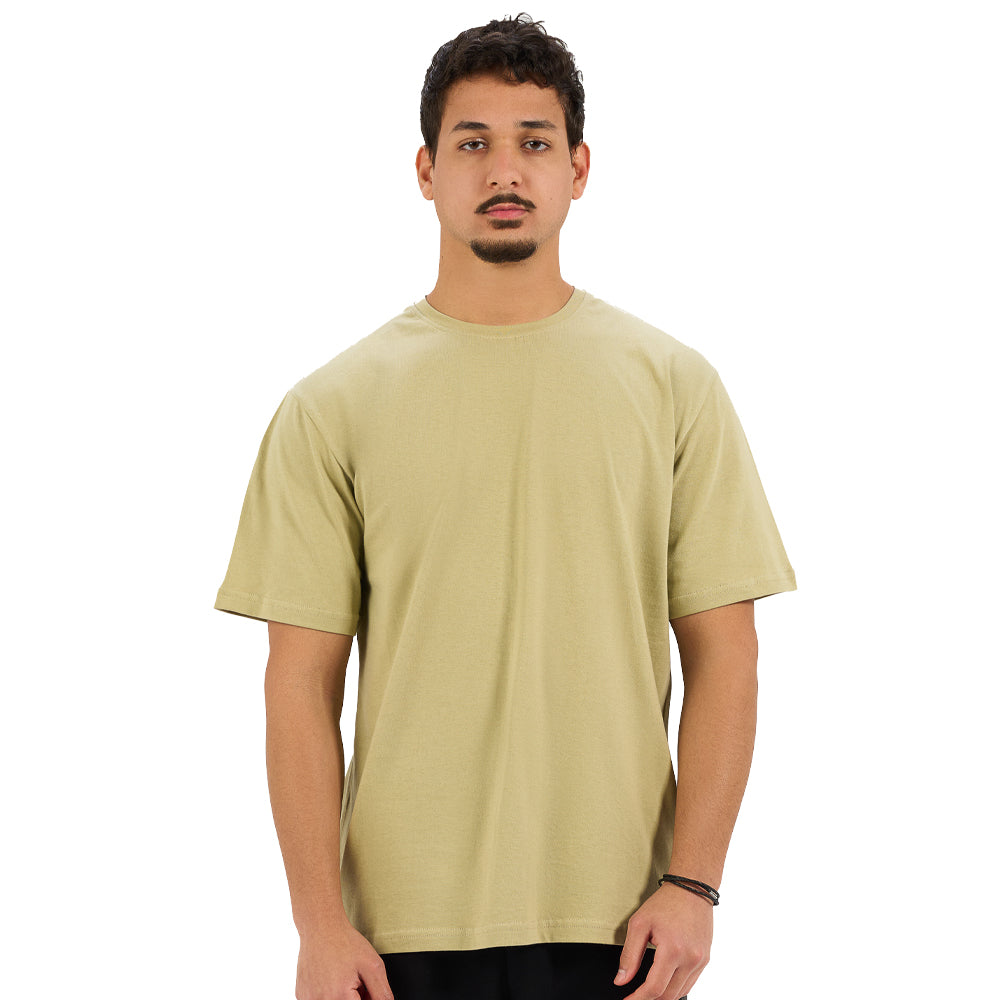Man wearing a light green t-shirt on a white background
