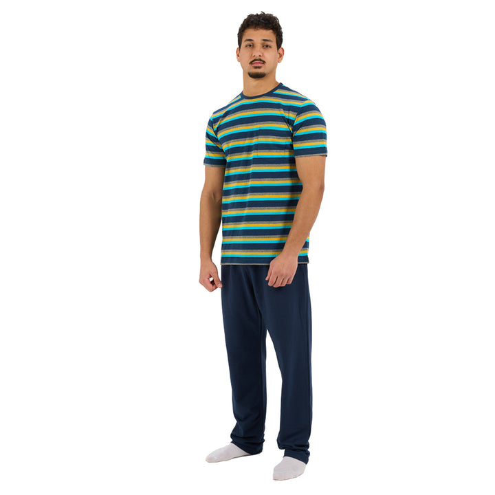 Man wearing a striped shirt and dark pants on a white background